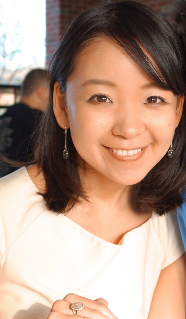 woman with short black hair smiling